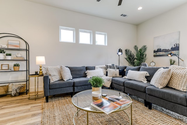 living area with light wood-style flooring, visible vents, ceiling fan, and recessed lighting