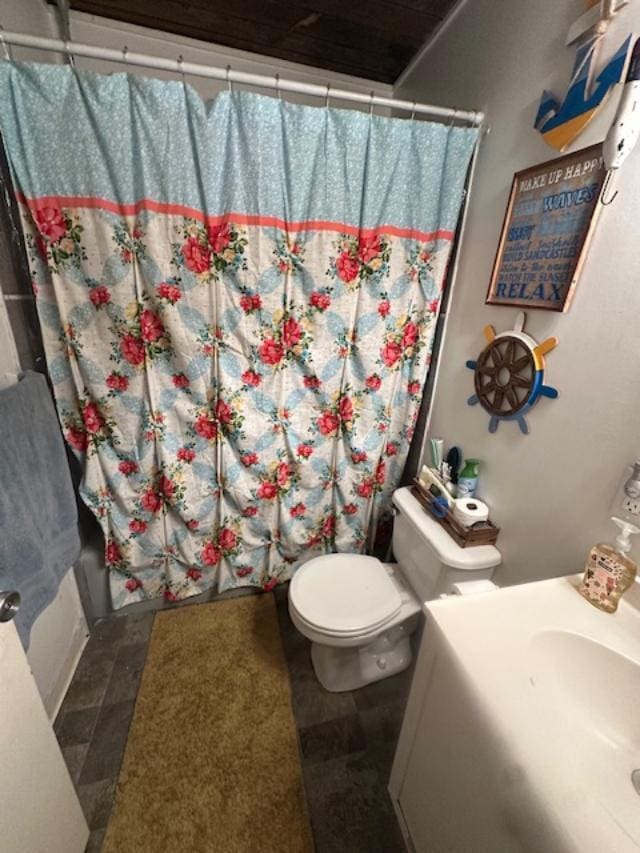 bathroom with toilet and shower / bath combo