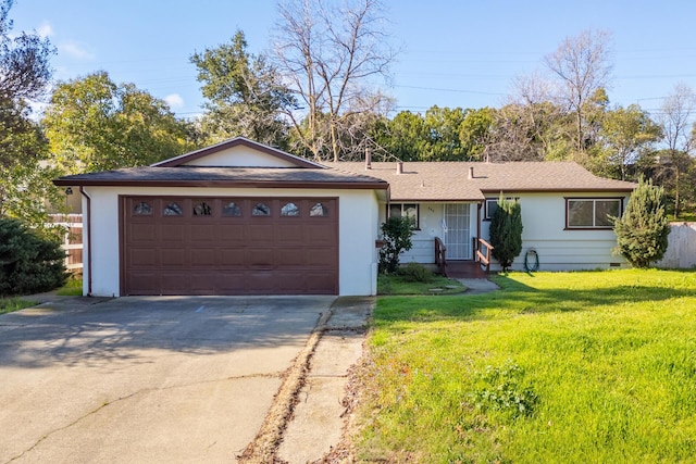 ranch-style house featuring an attached garage, concrete driveway, crawl space, and a front yard