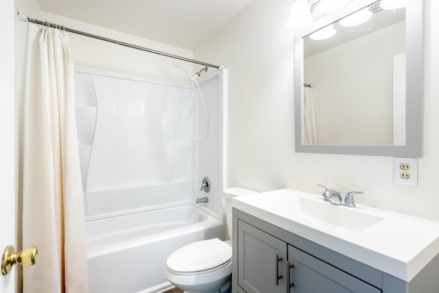 bathroom featuring toilet, visible vents, shower / tub combo with curtain, and vanity