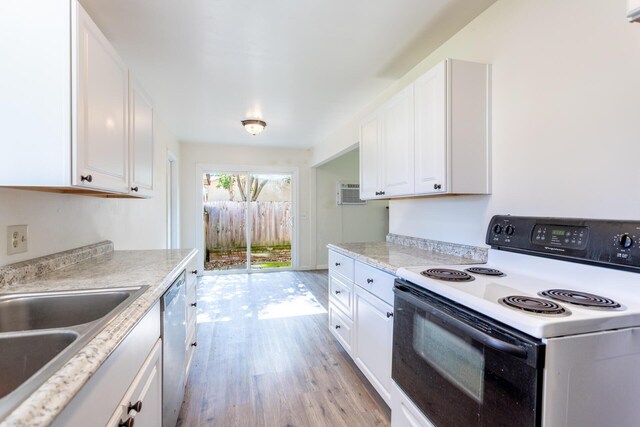 kitchen featuring electric range, white cabinets, dishwasher, light countertops, and light wood-style floors