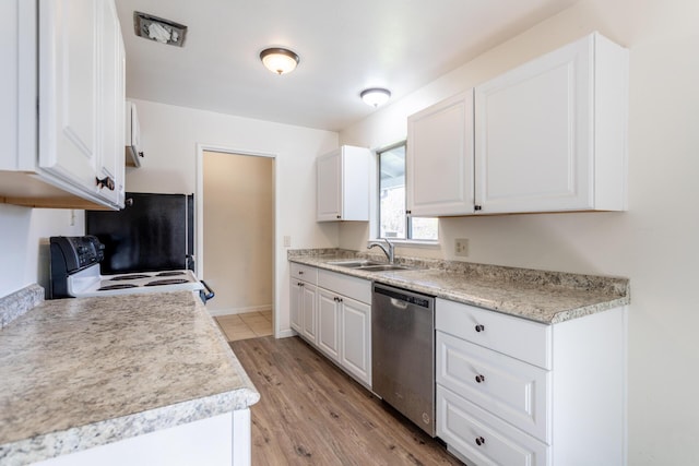 kitchen with electric stove, white cabinetry, a sink, and stainless steel dishwasher