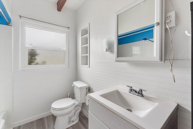 full bathroom with vanity, toilet, wood finished floors, and a shower