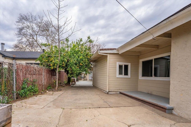 view of patio / terrace featuring fence