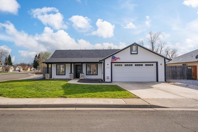 view of front of house featuring driveway, an attached garage, fence, and a front yard