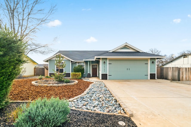 single story home featuring an attached garage, fence, and concrete driveway