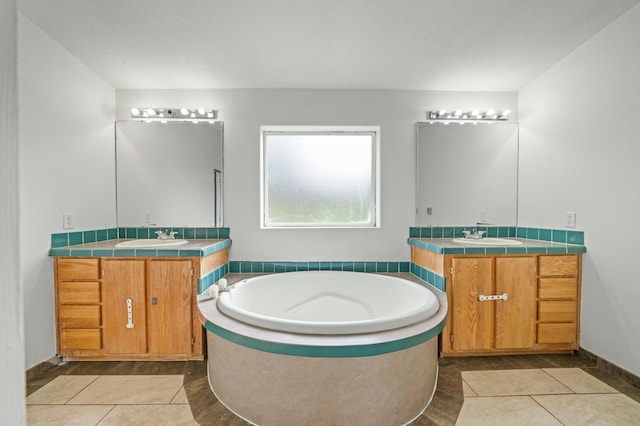 full bathroom featuring two vanities, a sink, and tile patterned floors