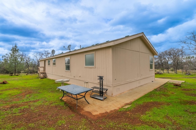 view of property exterior featuring crawl space and a lawn