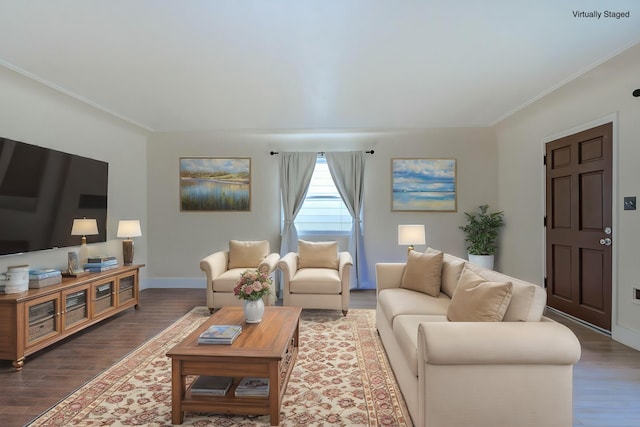 living room with baseboards, wood finished floors, and ornamental molding