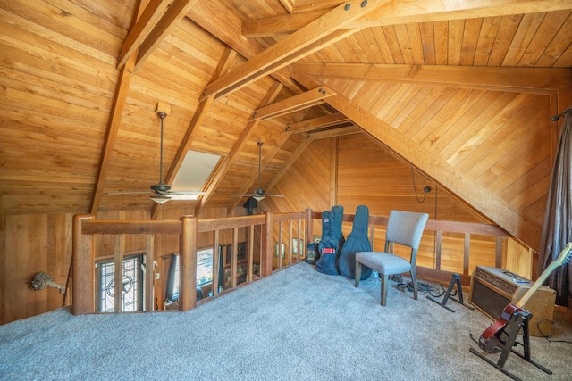 living area with lofted ceiling with beams, wood walls, carpet flooring, and wood ceiling