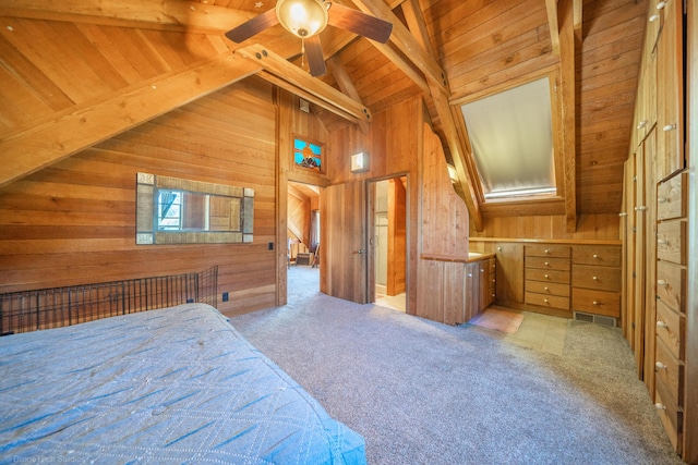 carpeted bedroom featuring wooden ceiling, visible vents, wood walls, and lofted ceiling with beams