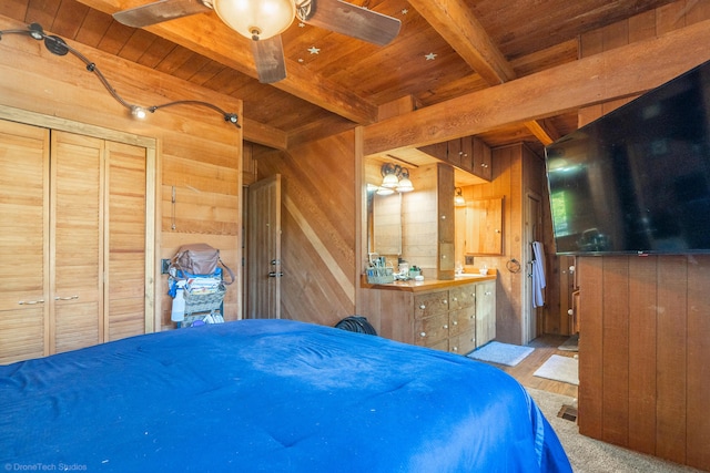 bedroom featuring wood ceiling, wood walls, and beamed ceiling