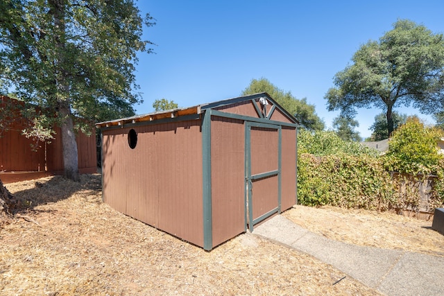 view of shed with a fenced backyard