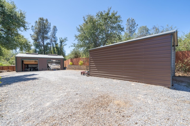 garage with fence