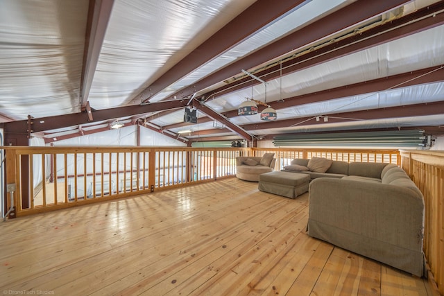 living room with lofted ceiling and hardwood / wood-style flooring