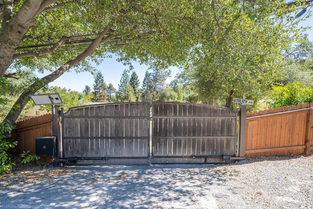 view of gate with fence