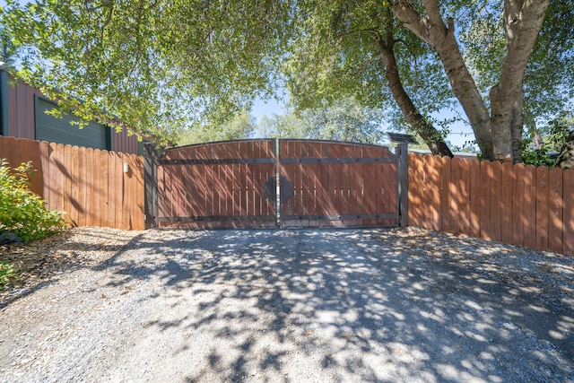 view of gate featuring fence