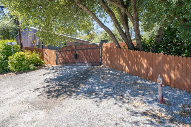 view of yard with fence and a gate