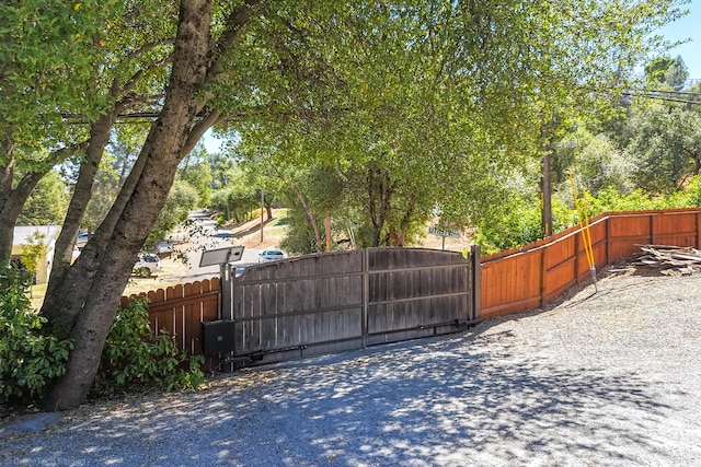 view of gate featuring fence