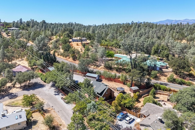 aerial view featuring a mountain view and a wooded view