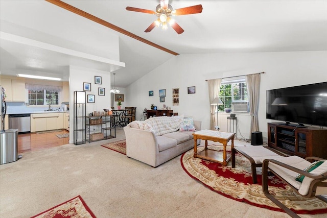 living room featuring a ceiling fan, lofted ceiling with beams, and light colored carpet