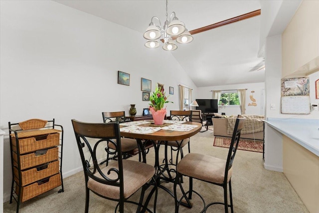 dining area featuring baseboards, vaulted ceiling, a chandelier, and light colored carpet