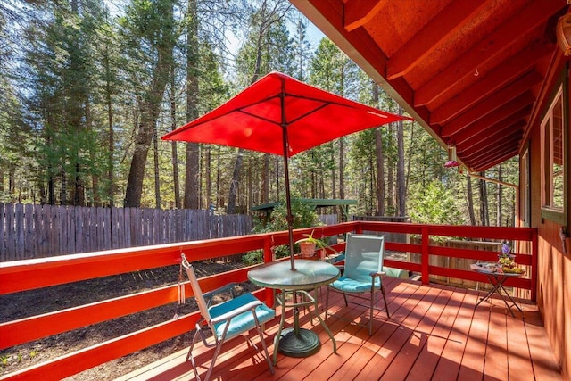 wooden deck featuring fence