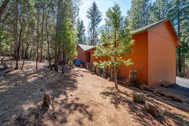 view of side of property featuring an outbuilding and a pole building