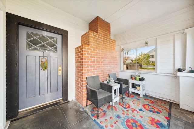 doorway to property with a porch