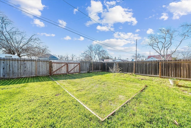 view of yard with a fenced backyard