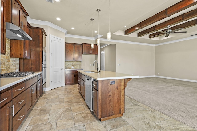 kitchen featuring a sink, ventilation hood, appliances with stainless steel finishes, baseboards, and light colored carpet