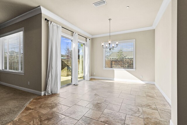 unfurnished dining area with an inviting chandelier, baseboards, visible vents, and ornamental molding