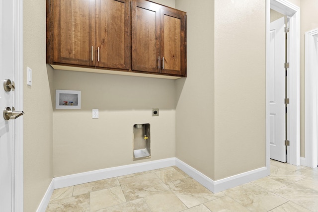 laundry area with cabinet space, electric dryer hookup, baseboards, and washer hookup