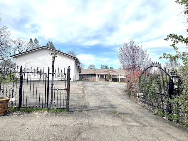 view of gate with fence