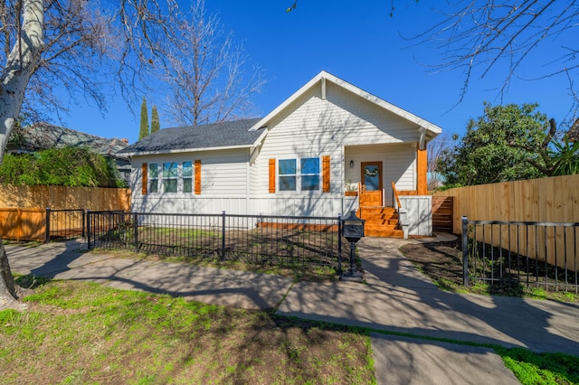 bungalow with a fenced front yard