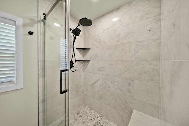 full bath with a shower stall