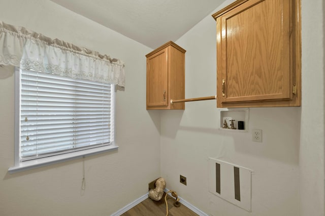 laundry room with wood finished floors, cabinet space, baseboards, hookup for an electric dryer, and hookup for a washing machine