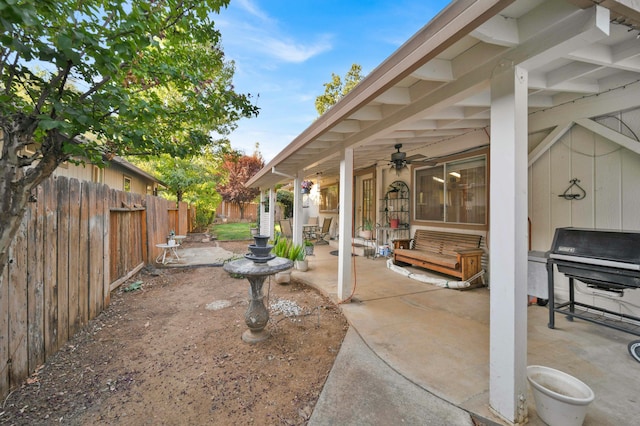 view of patio / terrace featuring a ceiling fan, fence, and grilling area