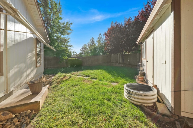 view of yard with a fenced backyard