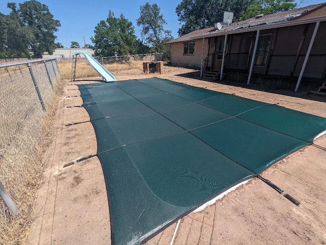 2341 Old Alturas Rd, Redding, CA 96003 - view of swimming pool with a water slide, a fenced backyard, a patio area, and entry steps