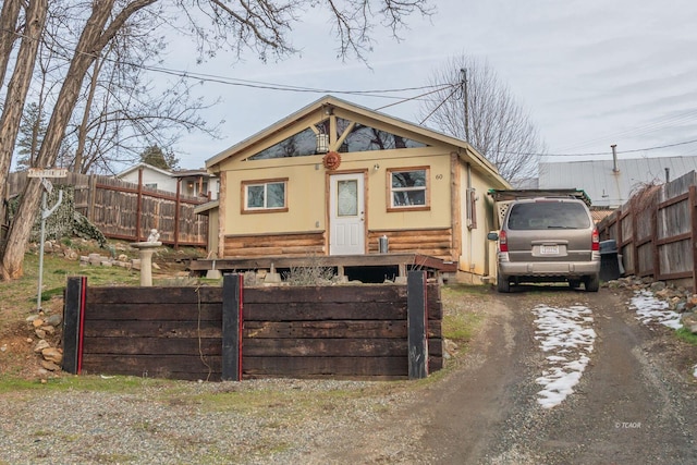 view of front of house with a fenced front yard and driveway