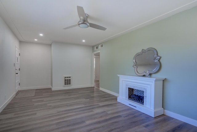 unfurnished living room featuring a high end fireplace, baseboards, recessed lighting, wood finished floors, and a ceiling fan