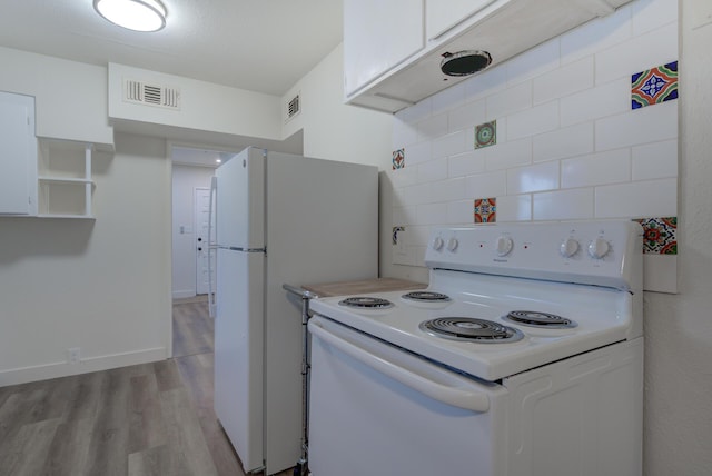 kitchen featuring white cabinetry, white appliances, visible vents, and light wood finished floors