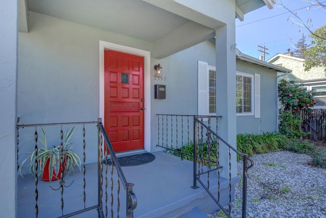 property entrance featuring stucco siding