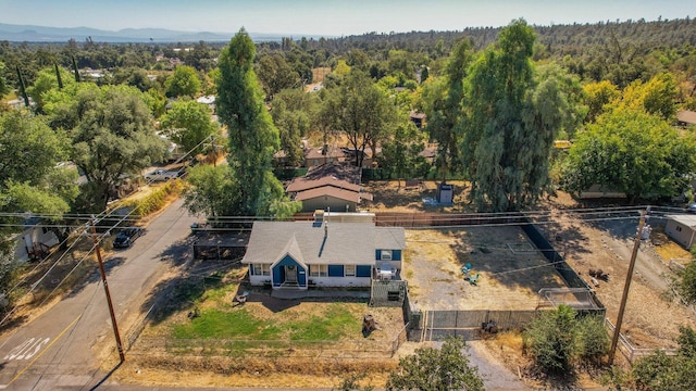 bird's eye view with a view of trees and a mountain view