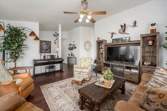 living area with ceiling fan and wood finished floors