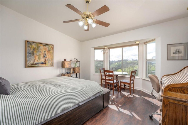 bedroom with baseboards, lofted ceiling, ceiling fan, and dark wood-style flooring