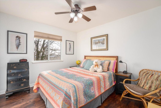 bedroom featuring dark wood-type flooring and a ceiling fan