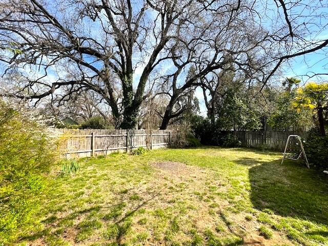 view of yard with a fenced backyard