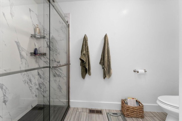 24894 Long St, Fall River Mills, CA 96028 - bathroom with toilet, a marble finish shower, and baseboards